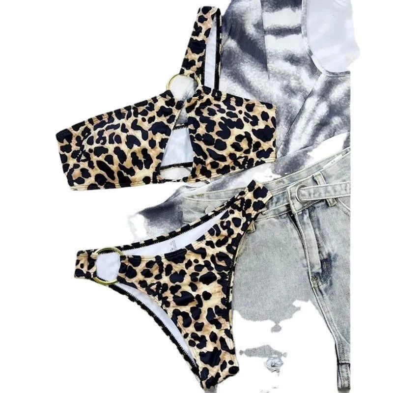 Women's leopard print and polka dot bikini set with top and shorts on a mannequin.