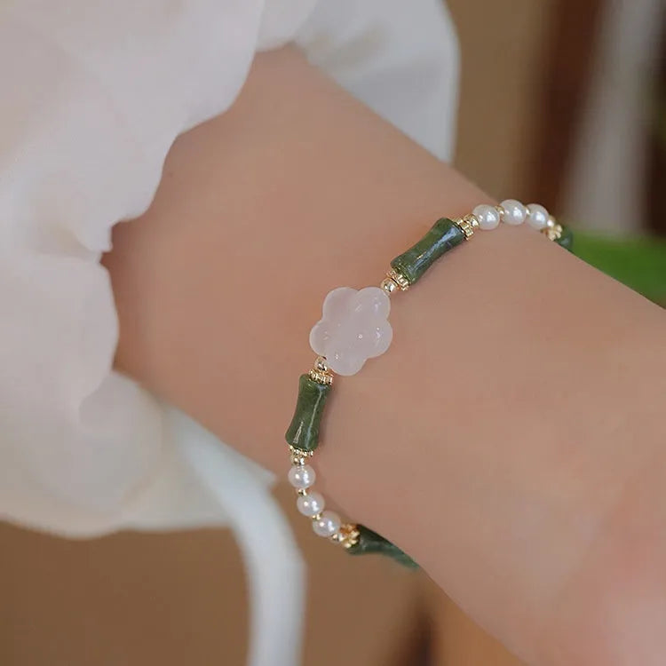 Chinese style bamboo joint bracelet with shell pearls, Hetian jade, and copper connectors