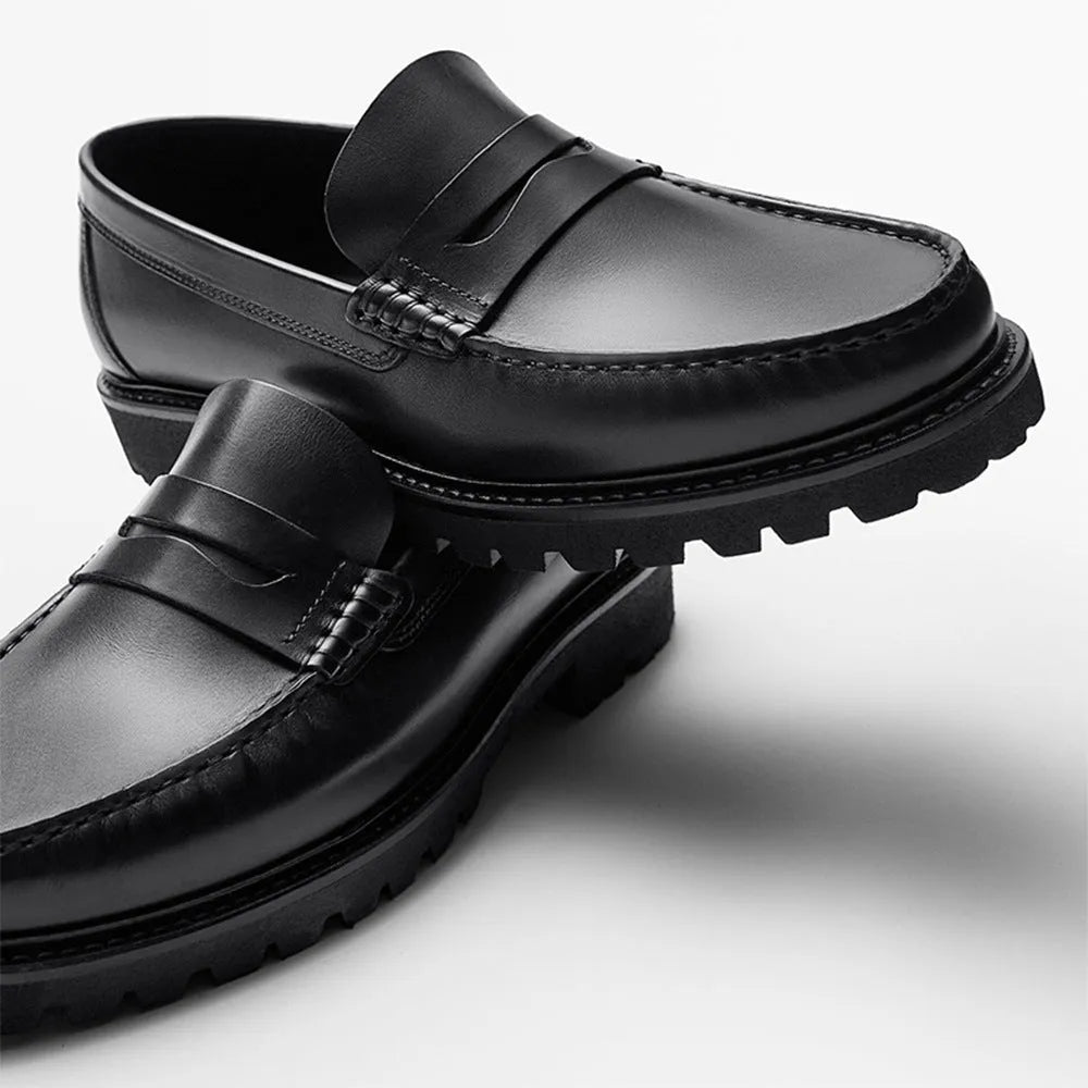 Men's brown leather loafers with first layer cowhide upper, rubber sole, and low heel on a neutral background