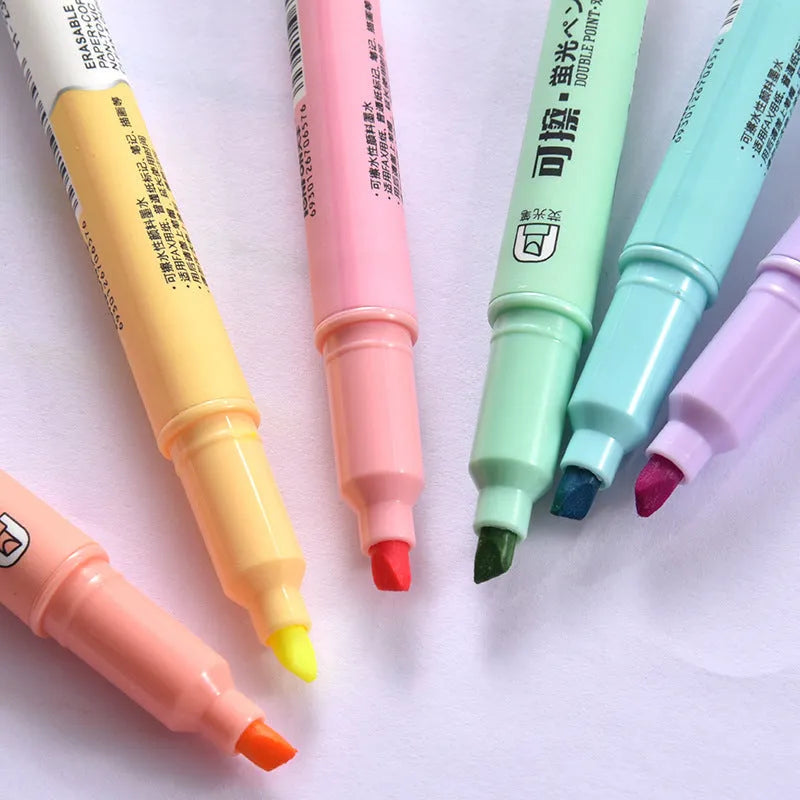 Set of six double-headed fluorescent graffiti marker pens with plastic shells in assorted colours
