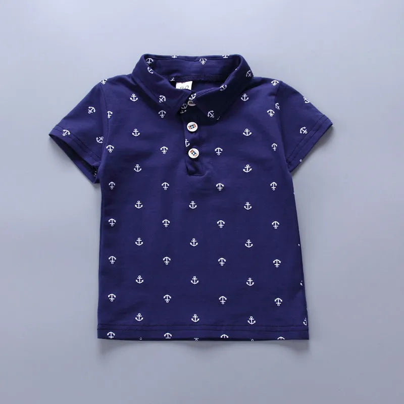 Anchor printed cotton trousers suit set for infants in blue, with short sleeves and pullover closure.