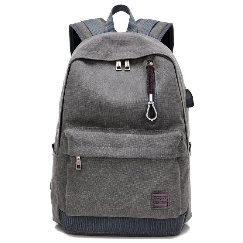 Coffee-coloured canvas backpack with USB charging port and multiple compartments.