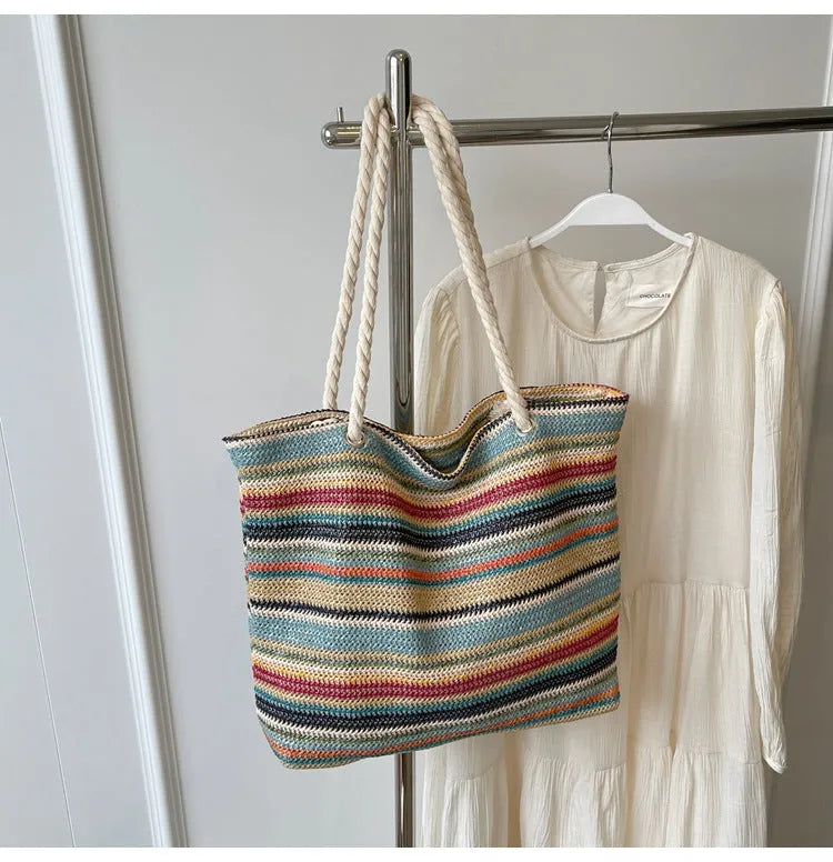 Blue straw and nylon woven large shoulder bag with polyester lining.