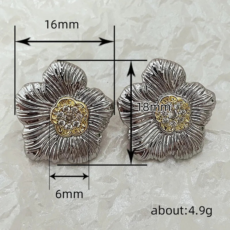 Retro copper stud earrings with textured gardenia floral design and two-tone electroplated finish