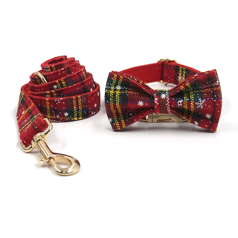 Red Christmas fabric pet collar set with matching harness, rope, bow, and waste bag