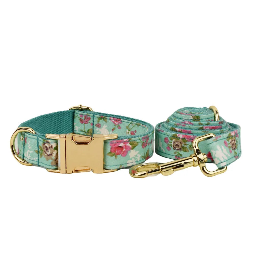 Rose pattern dog collar set on green background with detachable bow and matching leash
