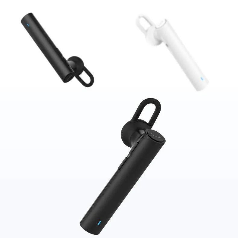Compact black and white wireless Bluetooth headset for hands-free calls, shown next to a size scale.