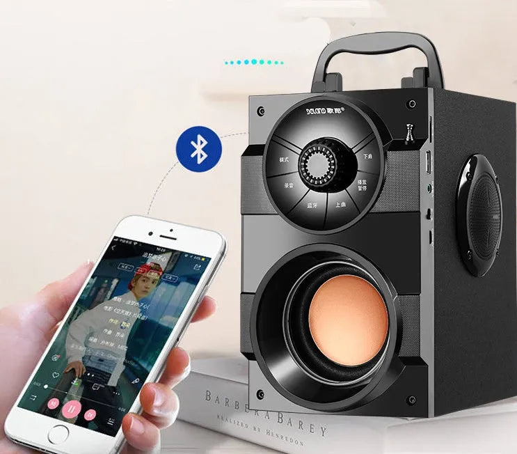 Black portable mini home audio system with subwoofer and 3.5mm audio cable