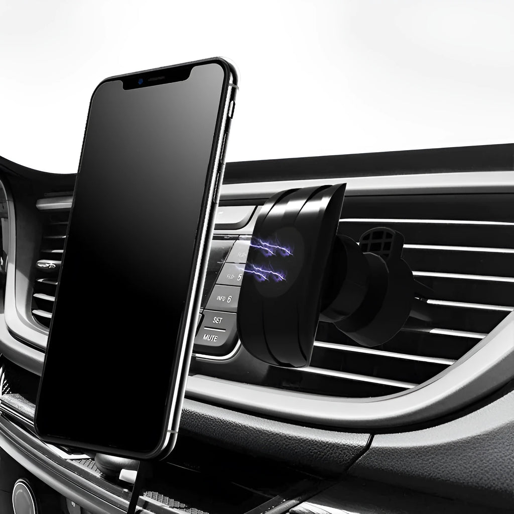 Black car phone holder clipped to vehicle air vent holding smartphone for navigation
