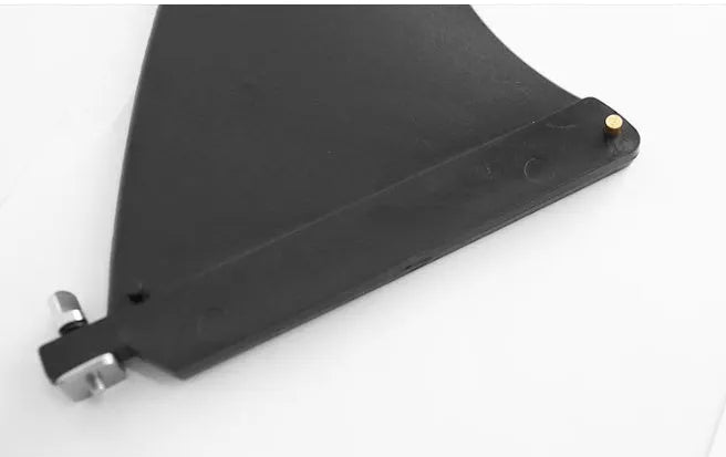 SUP paddle with a removable fish fin attached via a screw mechanism.