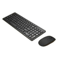 Black wireless keyboard and mouse set with USB receiver on a wooden desk.