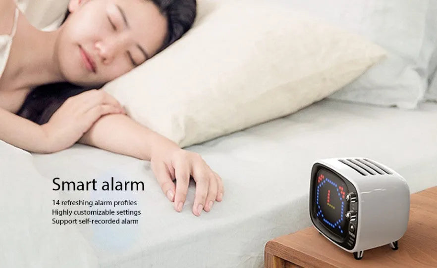 Portable Bluetooth speaker and alarm clock unit in one of six colour options: black, blue, green, pink, red, or white.