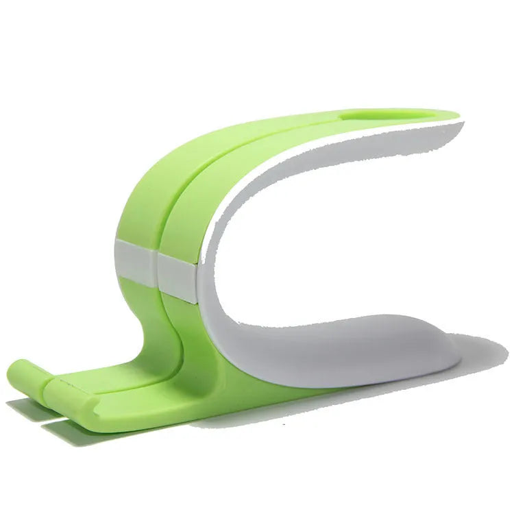 Grey and green Apple Watch iPhone charging stand showing dual-device desktop charging dock