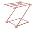 Foldable plastic towel shelf with vertical storage in light pink Nordic kitchen organiser
