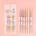 Six double-headed marker pens showing round and oblique nibs in assorted colours including orange, purple, yellow, green, blue, and pink