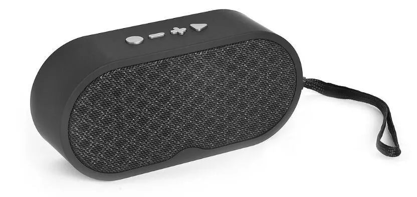 Grey portable Bluetooth speaker with subwoofer, HD microphone, TF card slot and USB port on a table.