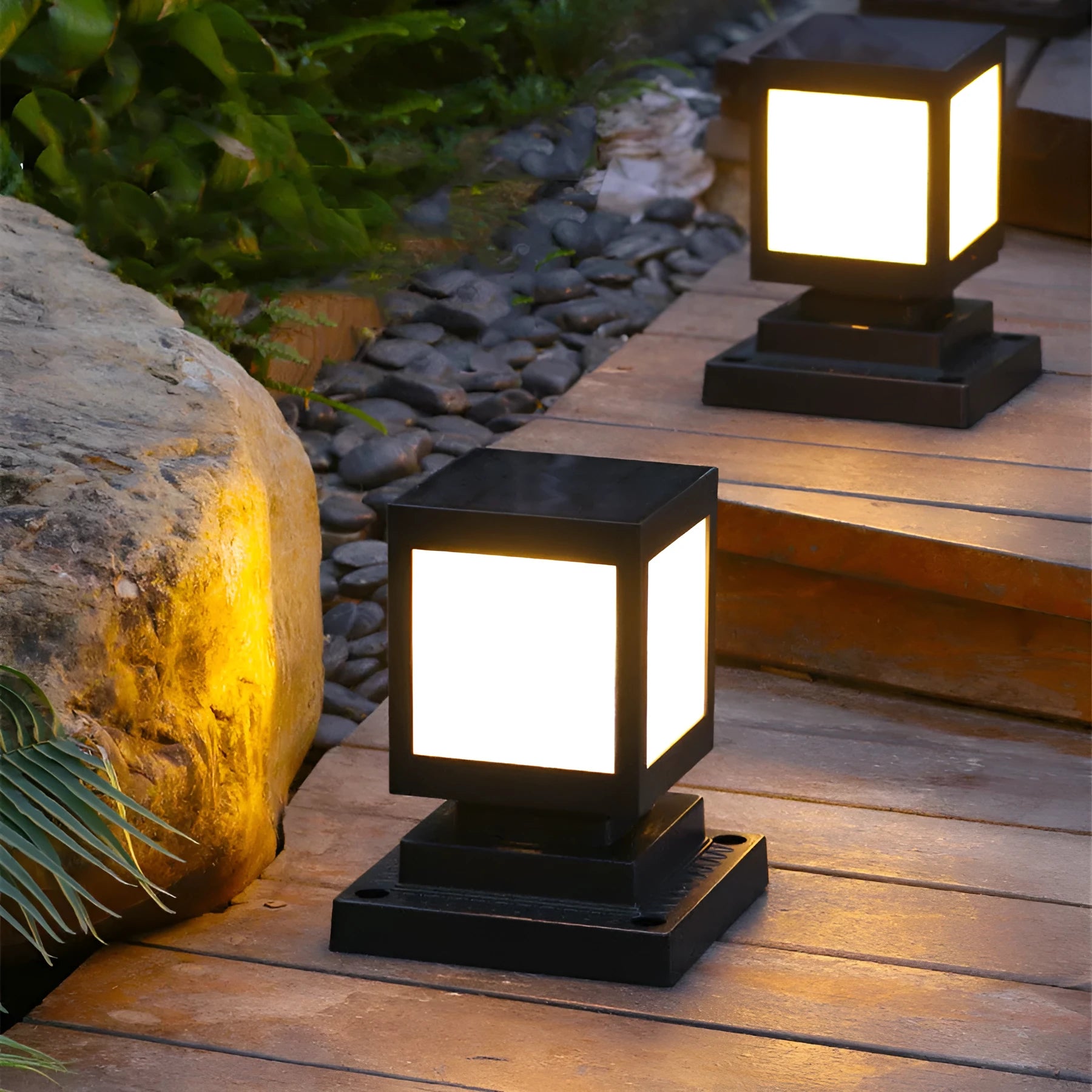 Waterproof solar-powered LED garden light installed on an outdoor wall.