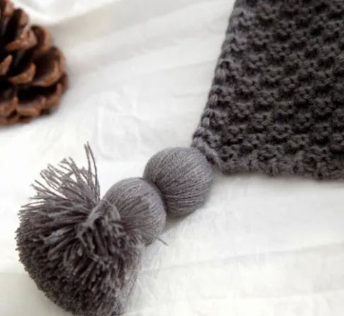 Nordic fringed knit ball blanket in acrylic measuring 130×170cm in beige colour