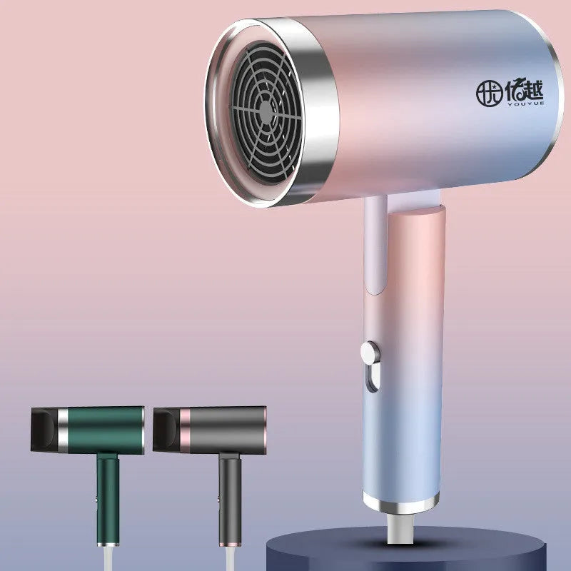 Foldable negative ion hair dryer in emerald green with nozzle attached