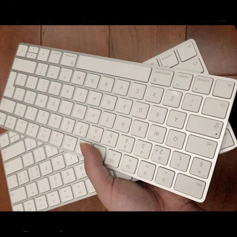 Brand new white Apple Bluetooth G6 wireless keyboard with multimedia keys in metal box.