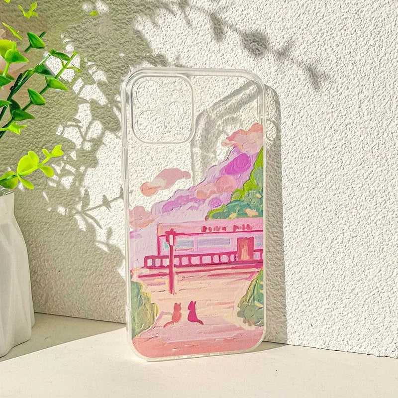 Soft silicone iPhone case with a cartoon design of two cats on the back.