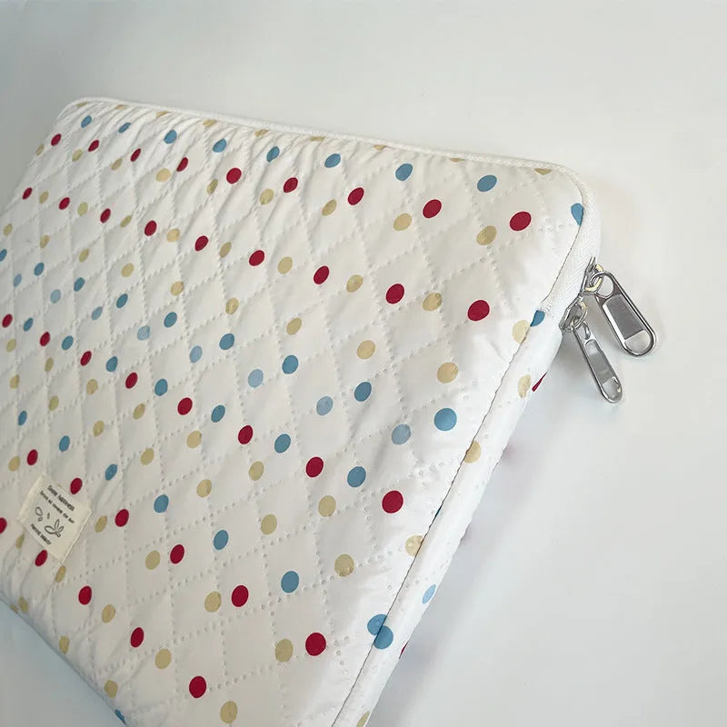 Polka dot patterned polyester laptop bag for women, shown in a solid colour with size options for 11, 13/14, and 15/15.6 inch laptops.
