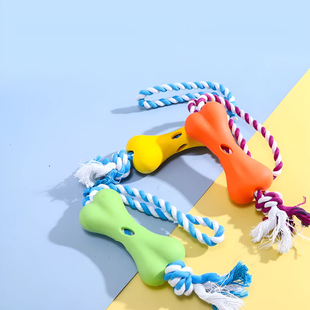 Small green bone-shaped rope knot dog toy with porous openings for treats