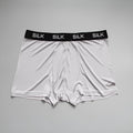 Men's loose-fit silk shorts in navy blue, shown on a mid-waist.
