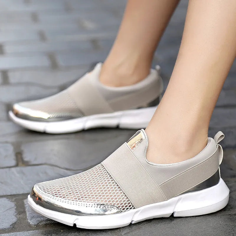 Women's low-top blue mesh sneakers on a white background.