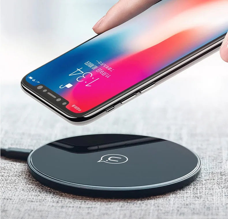 Glass disc wireless charger for smartphones in black or white with charging indicator