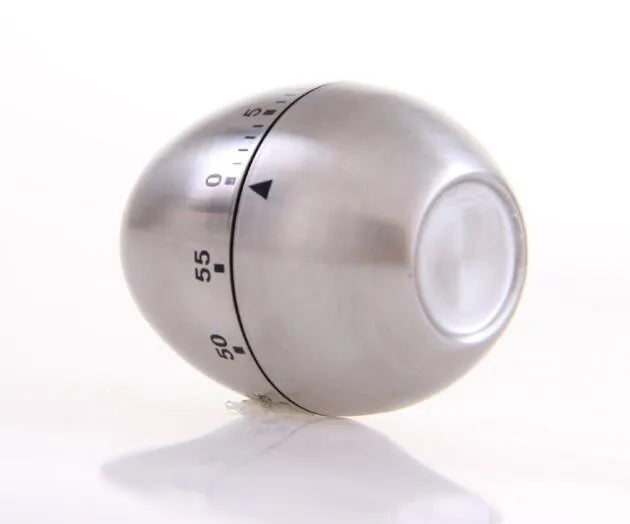 Stainless steel egg-shaped mechanical kitchen timer with manual dial.