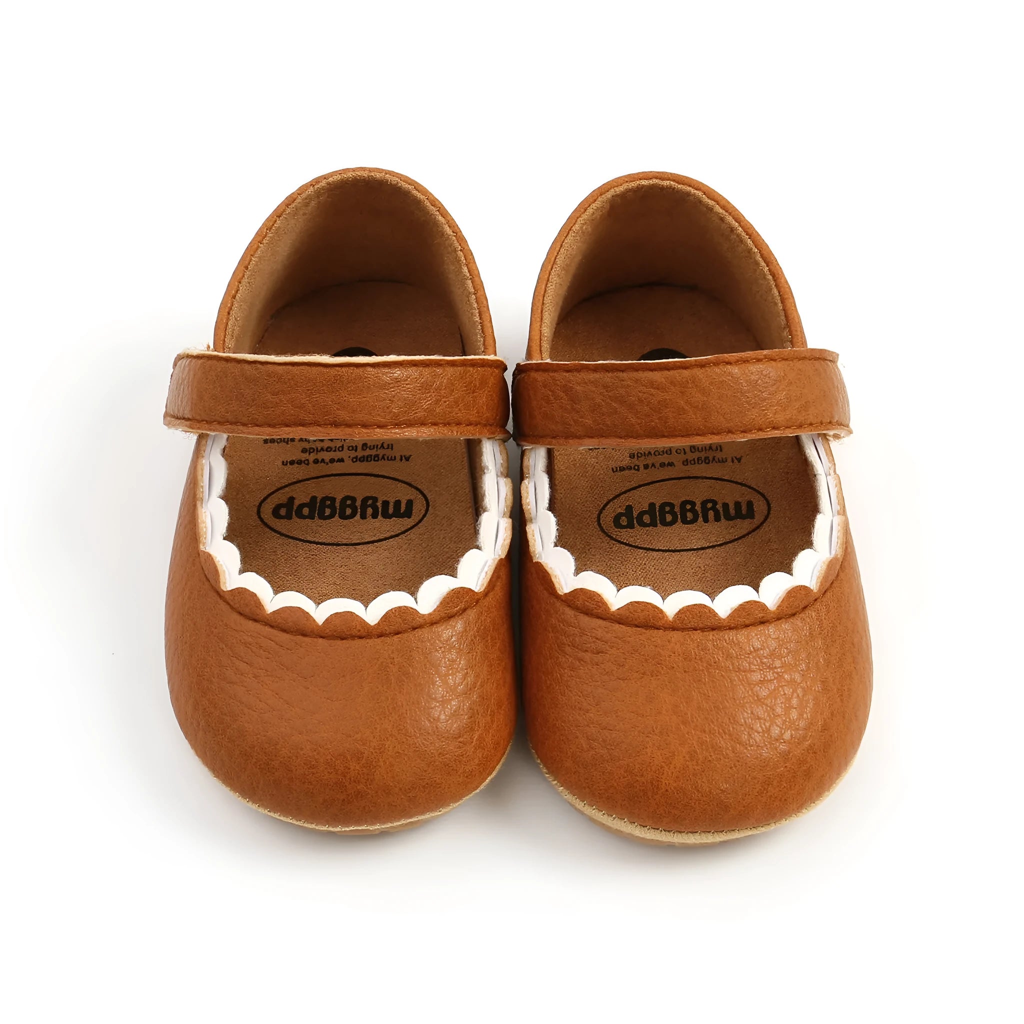 Baby girl's white velcro fastening shoes with low tube height, shown on a size chart.