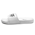 Men's large black and white open-toe personalised slippers with rubber soles on a plain background.