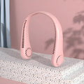 Pink portable bladeless neck fan hanging around a person's neck.