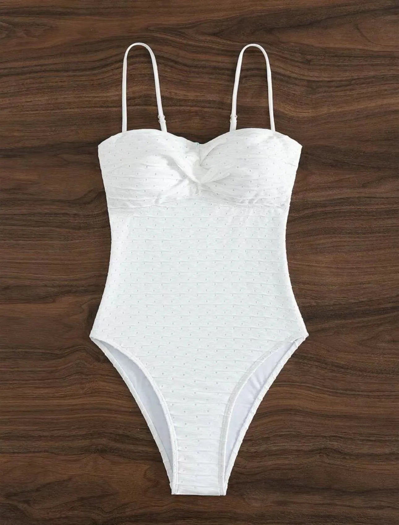 White one-piece swimsuit for women with sling back and briefs cut on a mannequin