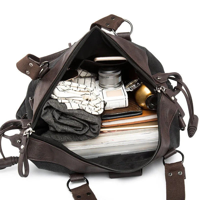 Men's cross body gym bag in Oxford cloth, 41cm wide, fits 17 inch laptop, black colour, with zipper and hardware accessories.