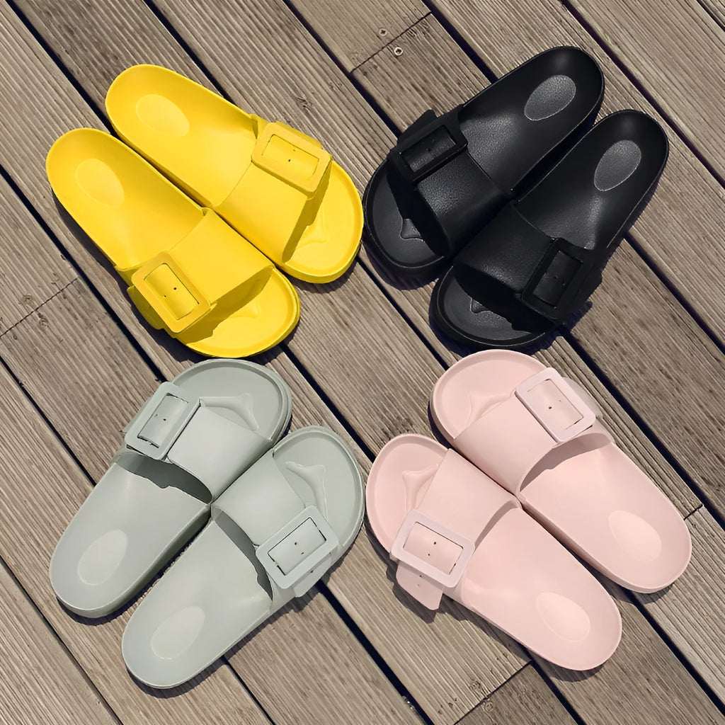 Women's grey blue buckle strap sandals with a soft EVA sole on a light background.