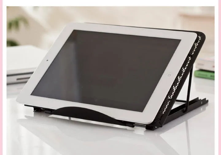 Folding aluminium laptop stand in silver colour, shown at an angle with a laptop on it