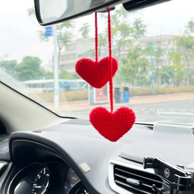 Green and white knitted wool car plant decoration with 8cm base and hanging rope.