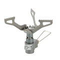 Silver portable propane camping stove with one-piece burner unit on a flat surface.