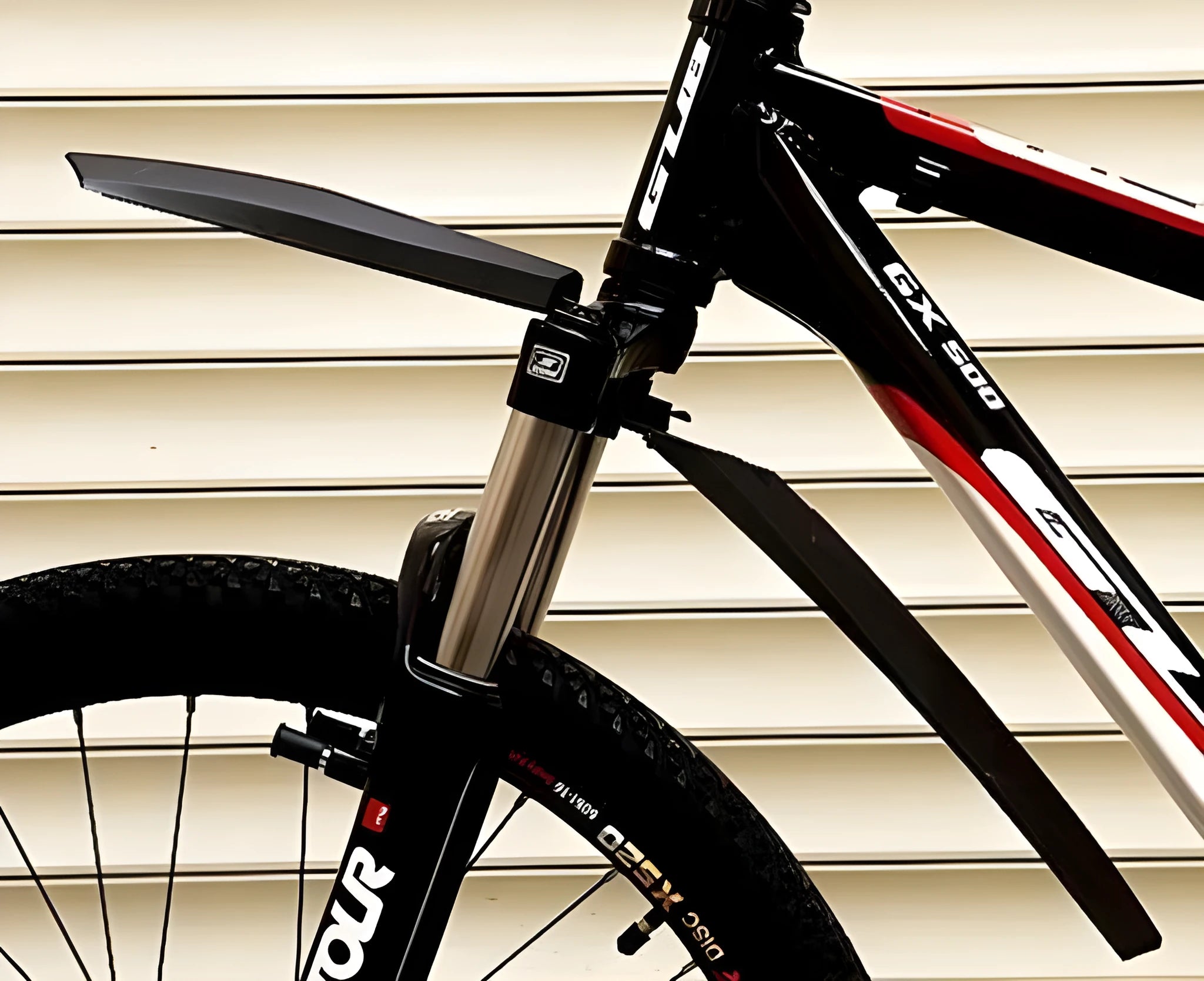 Set of colourful plastic front and rear mountain bike mudguards with quick-release mounting hardware.