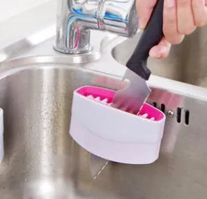 Kitchen cleaning brush with knife fork chopstick scrubbers and suction cup base in blue green pink colours