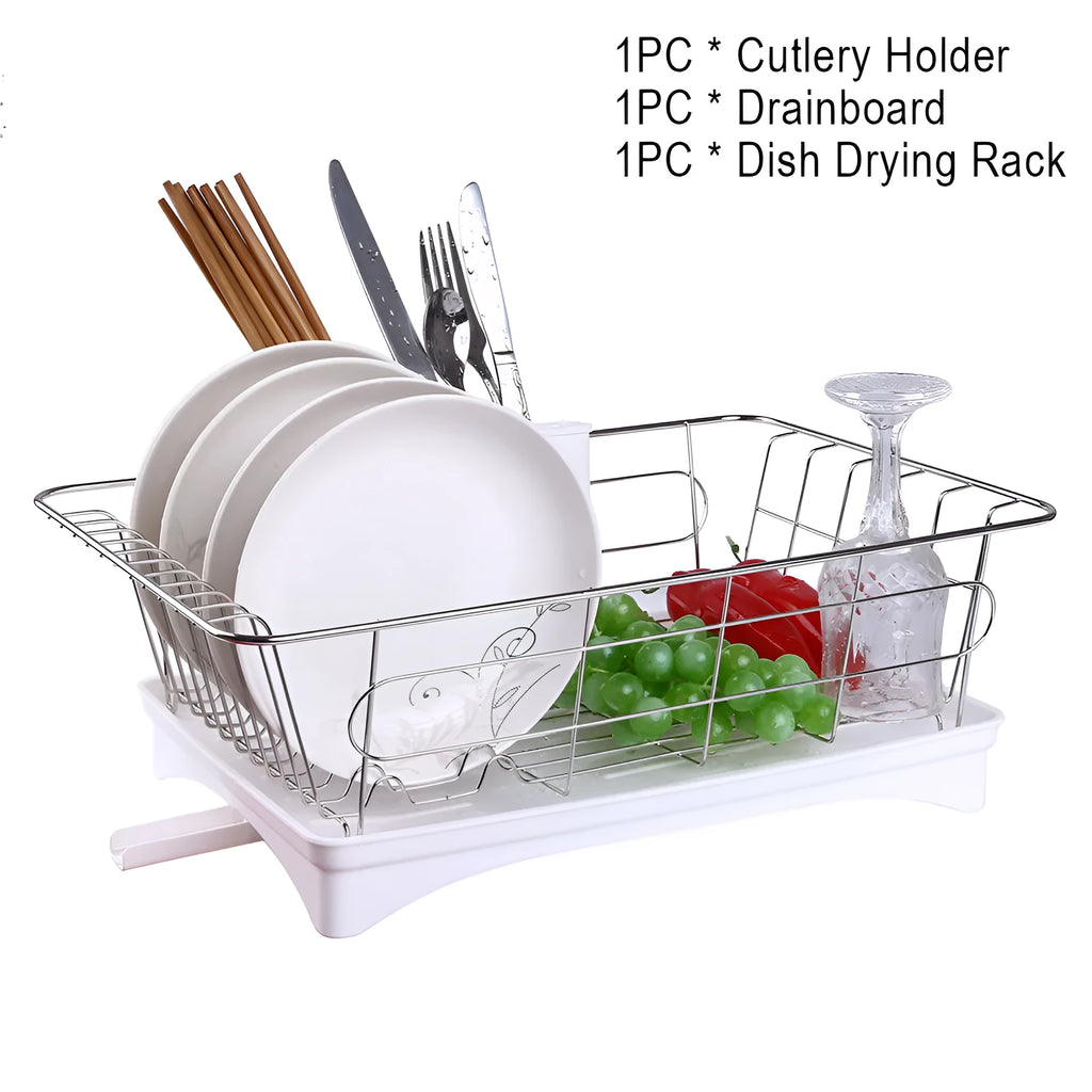 Black stainless steel dish drying rack with plastic cutlery holder and drain board on a kitchen counter.