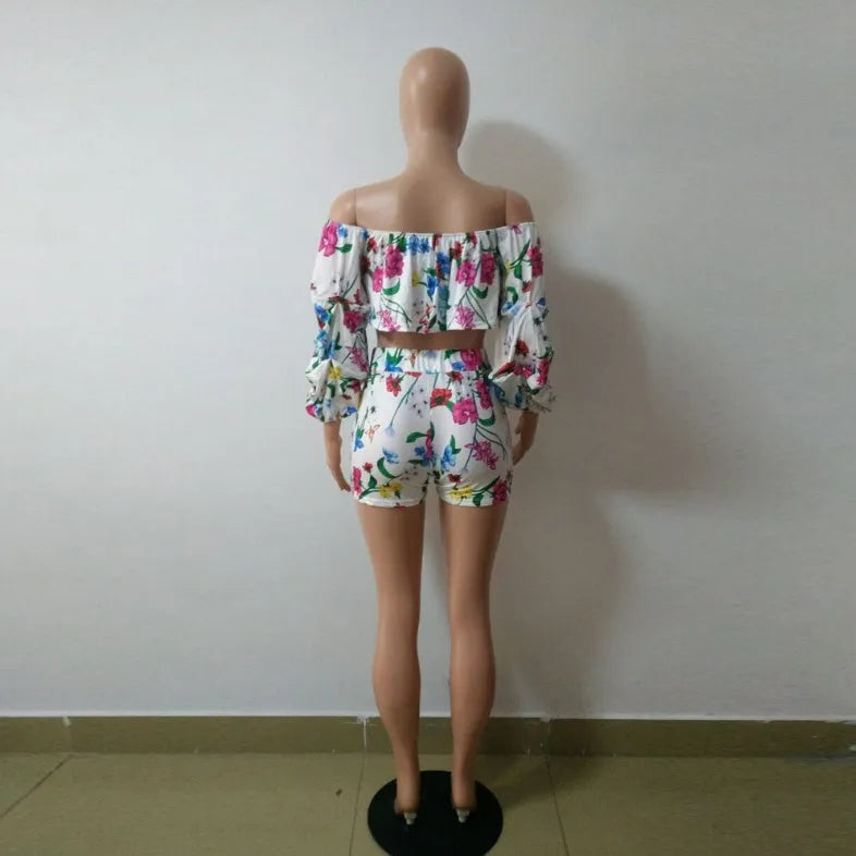 Women's multicolour digital print pyjama set with a short top featuring fluffy long sleeves and matching shorts.