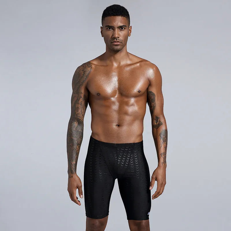 Men's solid colour swimming trunks in shark skin polyester fabric for beach surfing and swimming