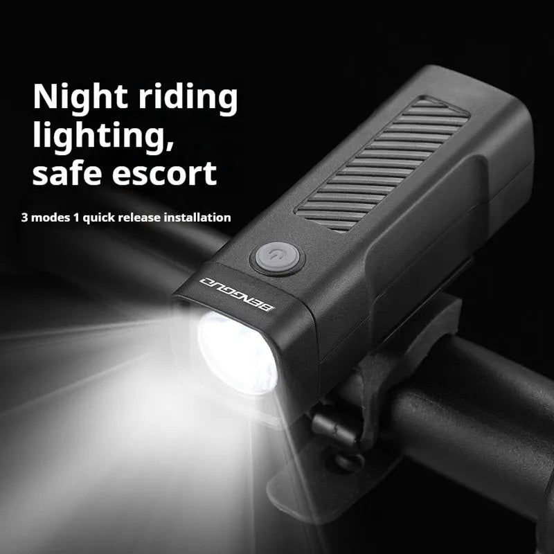 Black USB rechargeable bicycle headlight with quick-release strap mount on handlebars.