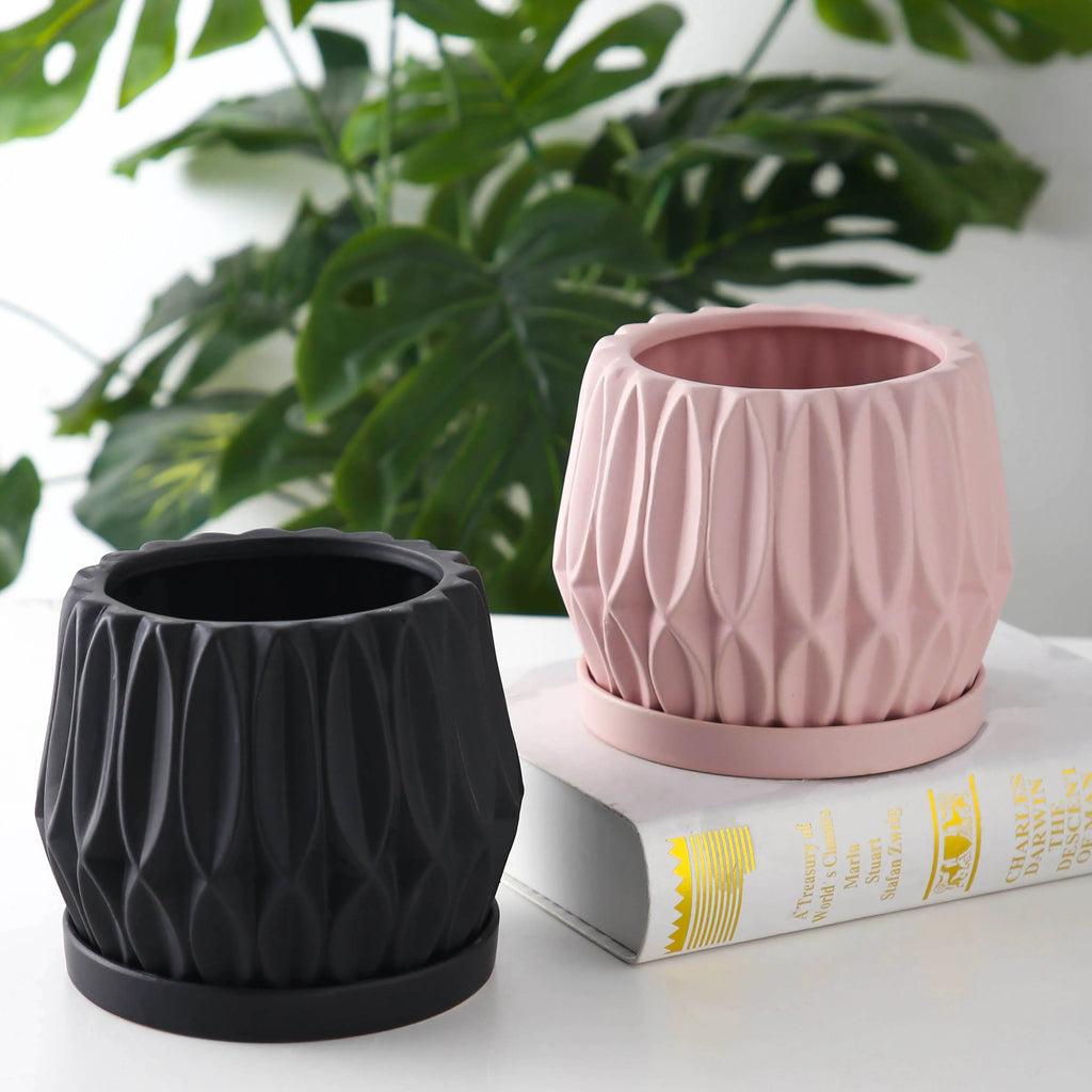 Medium grey ceramic tabletop plant pot for flowers and green plants