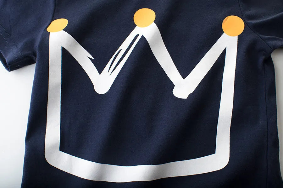 Boys' royal blue short sleeve cotton t-shirt laid flat, showing Korean style design.