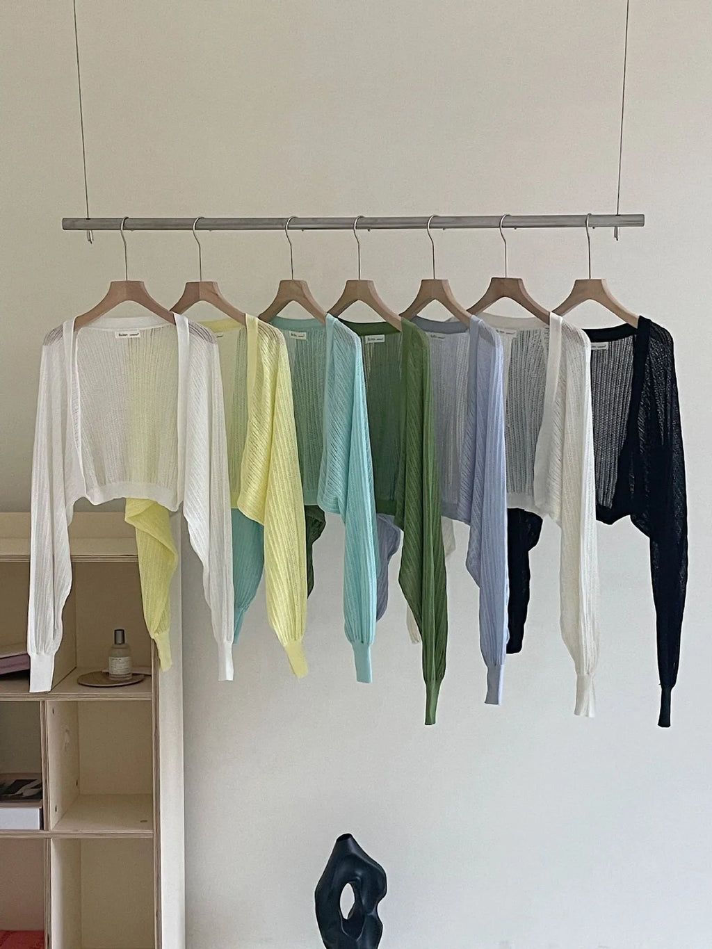 Thin polyester linen blouse with hollow out pattern and long lantern sleeves in apricot colour.