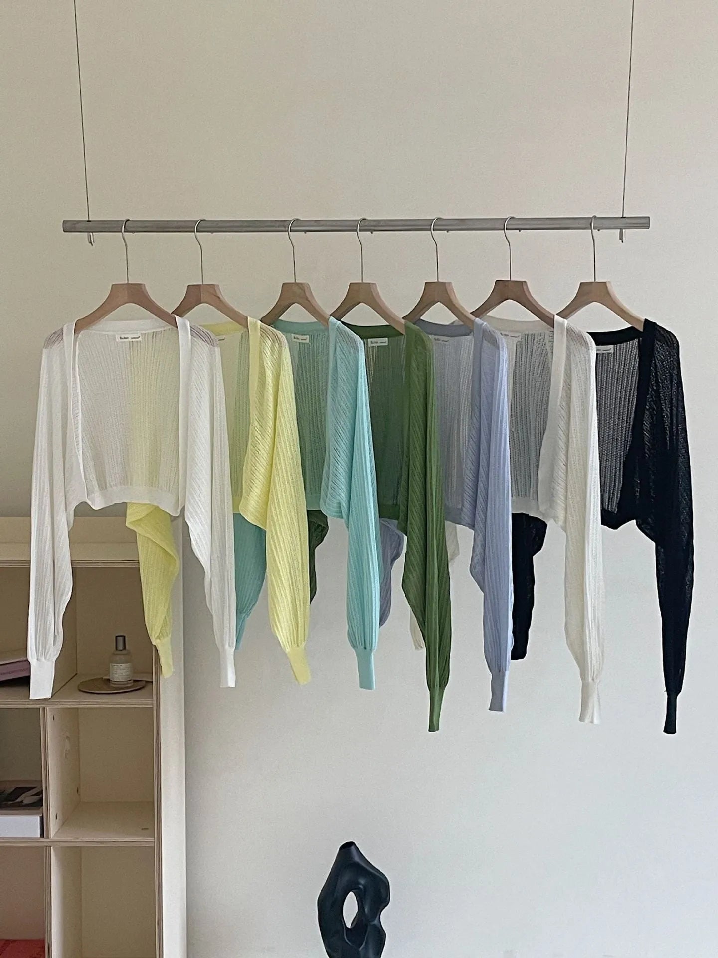 Thin polyester linen blouse with hollow out pattern and long lantern sleeves in apricot colour.